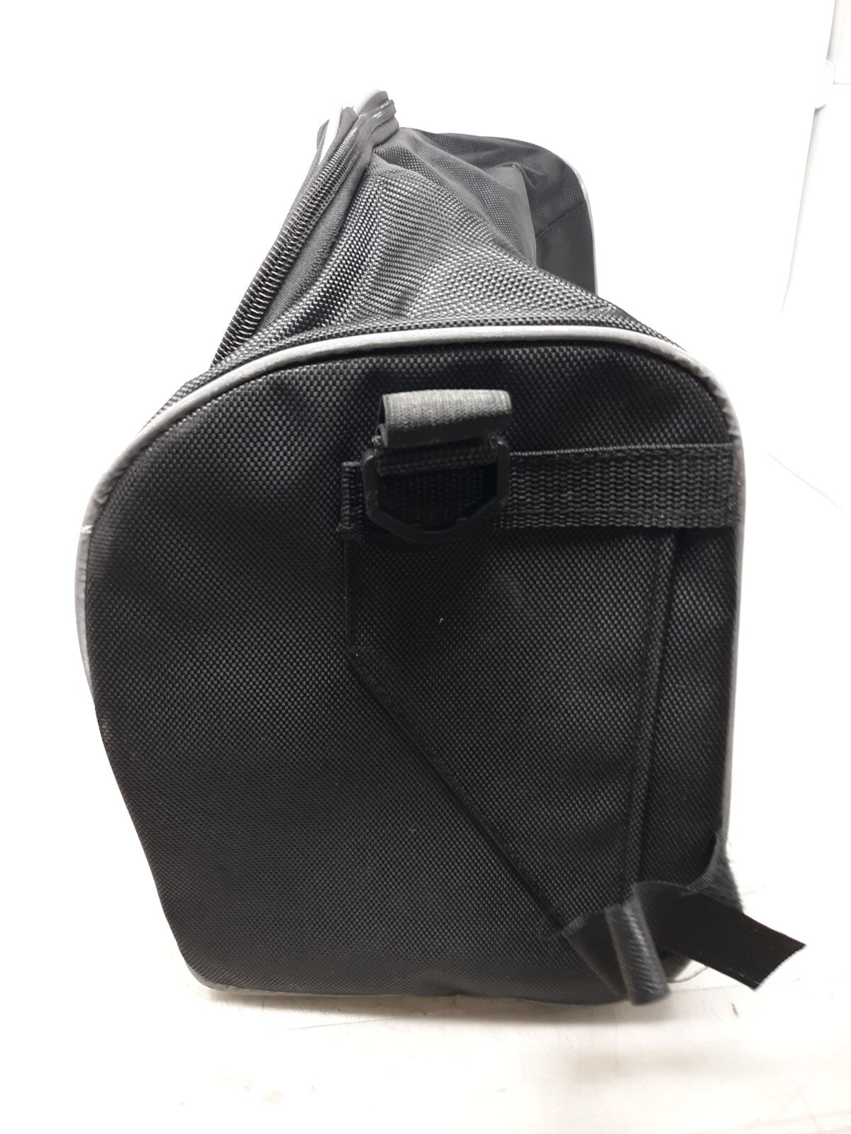 black travel bag with a zippered main compartment and mesh interior