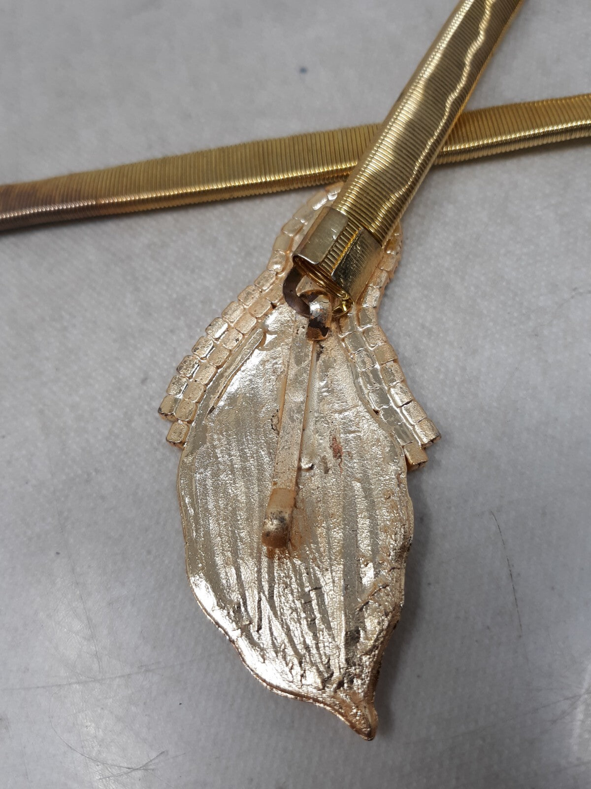 Gold Tone Stretch Snake Chain Skinny Belt with Leaf Buckle