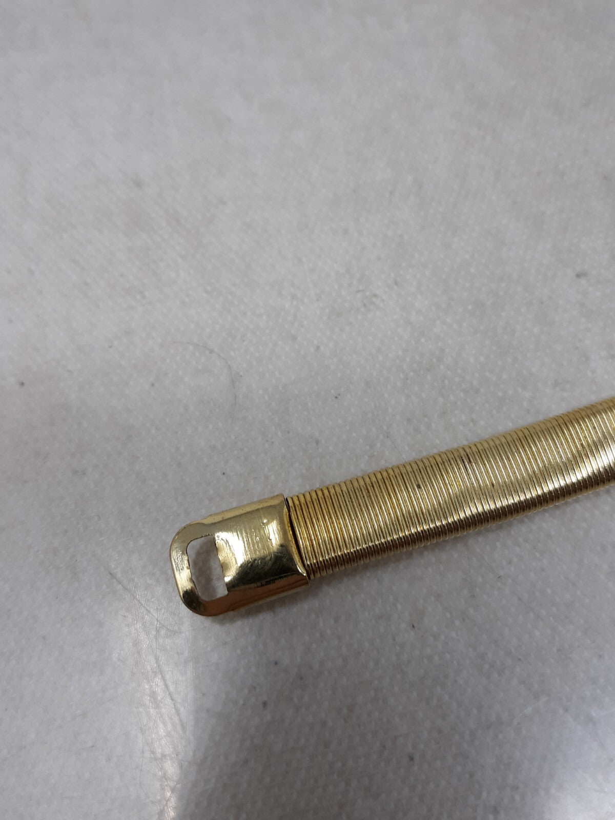 Gold Tone Stretch Snake Chain Skinny Belt with Leaf Buckle