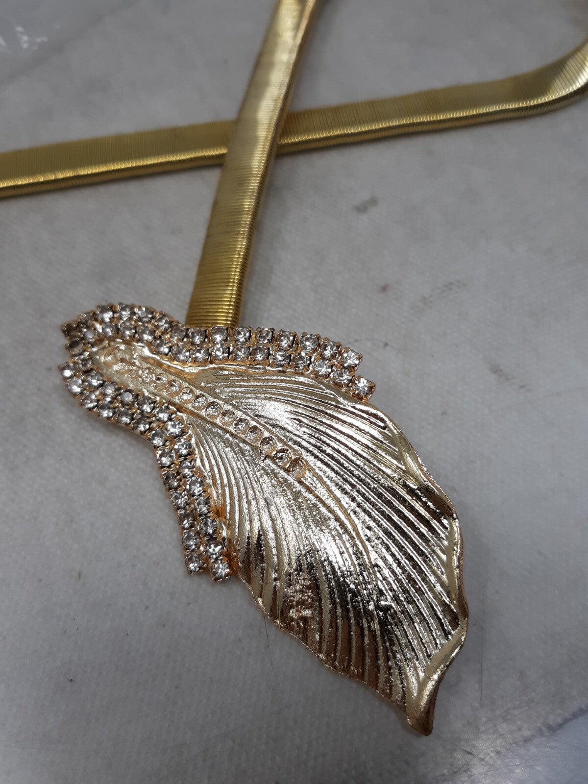 Gold Tone Stretch Snake Chain Skinny Belt with Leaf Buckle