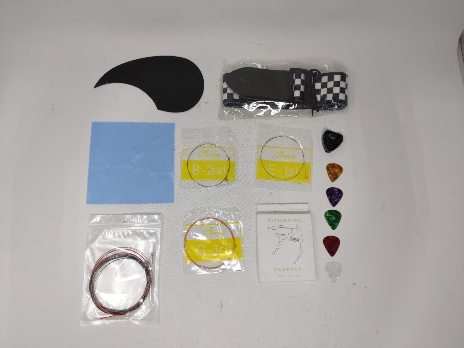 18pc Guitar Kit Capo + Strings + Picks + Pick Box + Guitar Checker Str ...