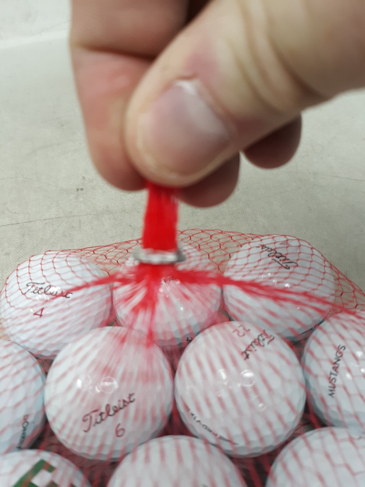 Titleist one dozen golf balls assorted.